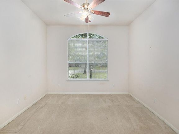 This home offers a split floorplan. Off the entry, a hallway leads to the 2 secondary bedrooms, but first we make a stop at this private study!
