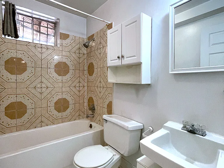 Bright bathroom with tub and shower