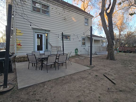 Back yard patio fully tree covered
