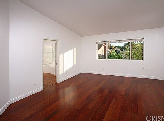 The spacious master suite is bathed in natural lig