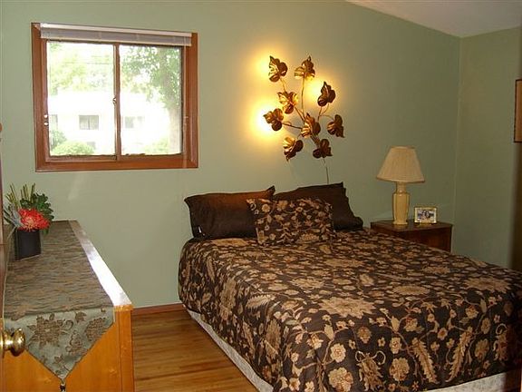 One of three bedrooms on main level also with vaulted ceilings