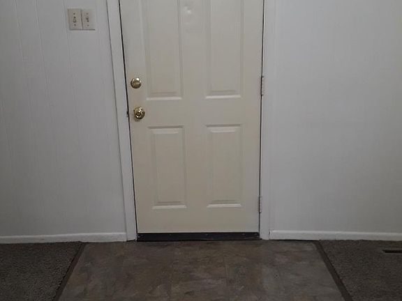 View of Front Door from inside Living Room.