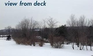 view from the deck : Behind the house is a lovely, wooded area, that can be enjoyed from the deck.