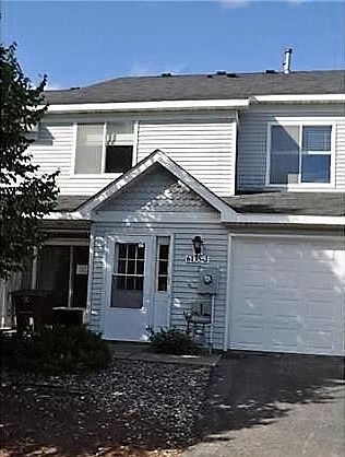 Attached garage with additional parking nearby