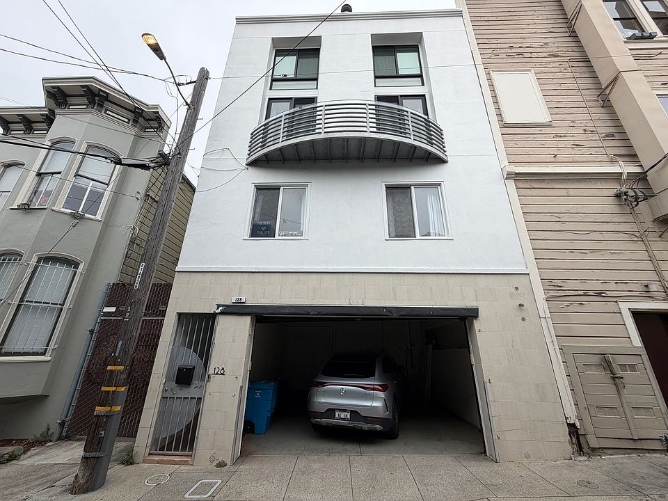 front of building with 2 cars side by side garage
