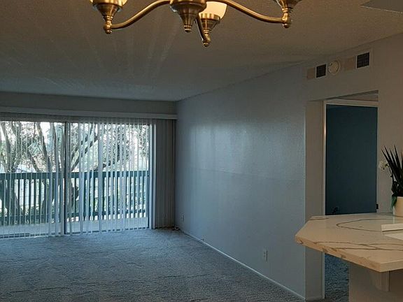 Living Room and balcony, new plush carpet throughout.