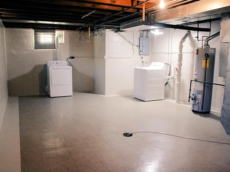 Basement with Plenty Storage Space, Laundry and all tile floor.