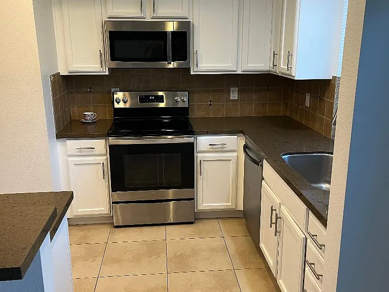 The kitchen has been freshly painted