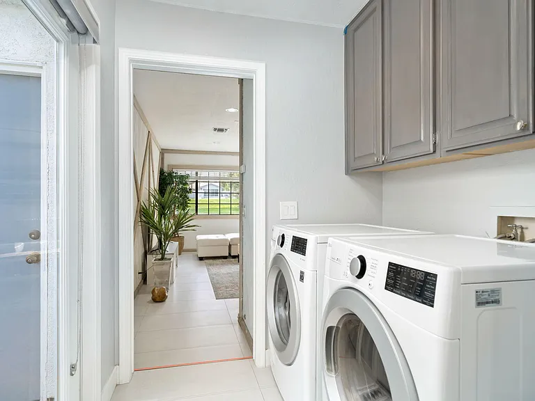 Laundry area leading into bonus room.