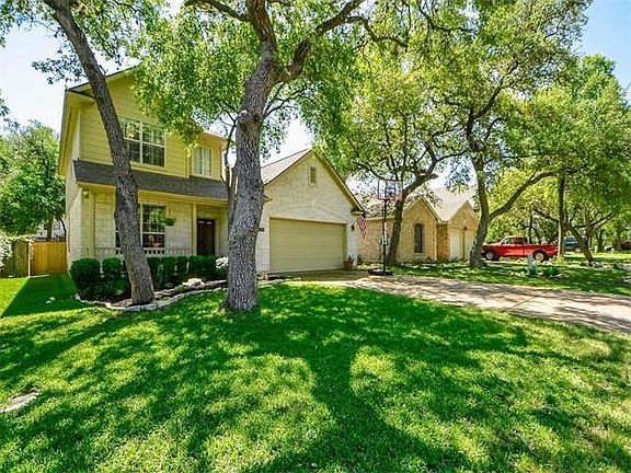 Nice long driveway, perfect for a game of hoops. Nice big trees for excellent shade!