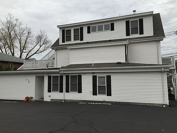 Back of house and parking. Apt on top floor