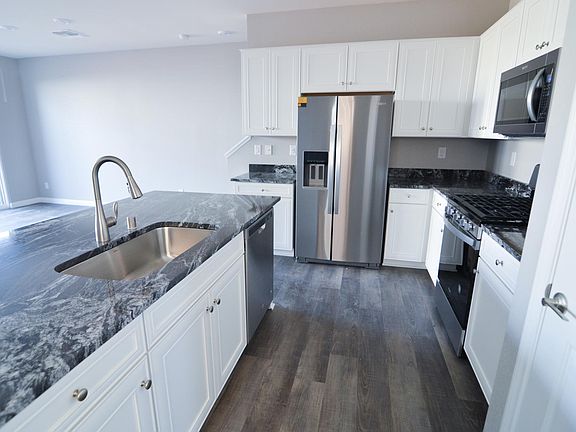 Kitchen has new cabinets, stainless steel appliances, huge sink and quartz countertops!
