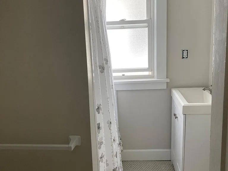 Bathroom featuring full-size tub with shower