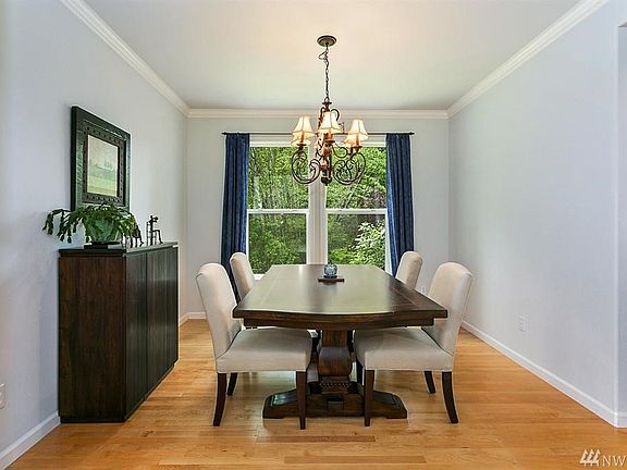 Formal dining room with view of private backyard.