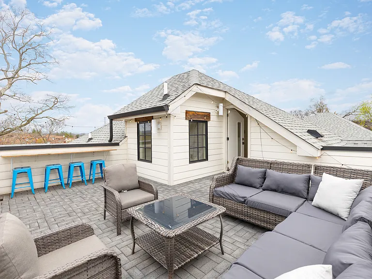 Private rooftop deck with plenty of seating and outdoor lights, allowing you to enjoy your morning cup of coffee or a late night conversation while overlooking the skyline.