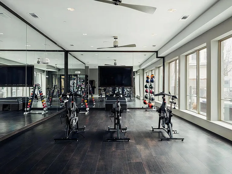 Private Fitness Studio with Indoor Cycling Equipment and Strength Accessories