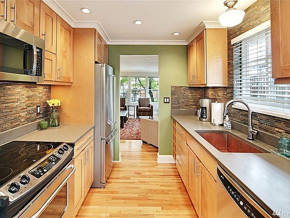 The updated kitchen with stainless appliances and plenty of cabinetry and counter space.