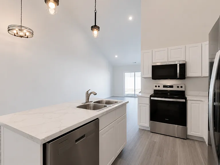 Kitchen open to dining and living area.
