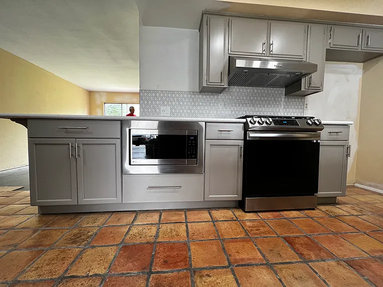 Shared kitchen - under counter microwave, gas stove and oven.