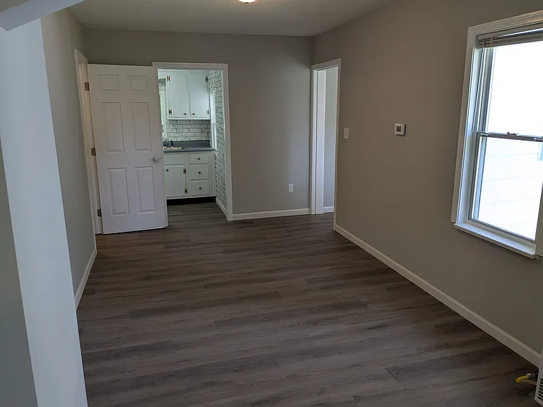 Bedroom door looking towards kitchen