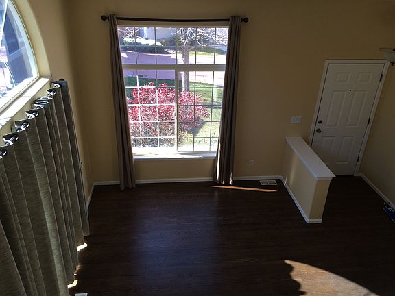 Main floor living room with hardwood floors, lots of natural
