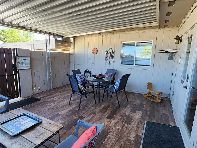 Tiled and covered patio conveniently near kitchen.