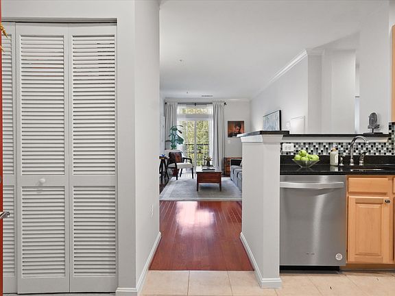 Kitchen / Laundruy closet on left / full size washer and dryer
