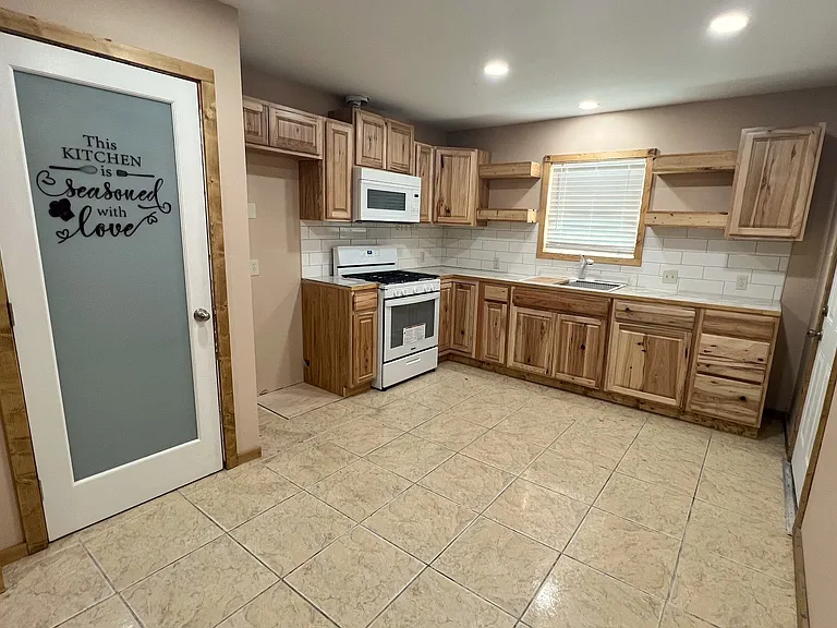 Lovely wood cabinets in kitchen, large pantry for storage