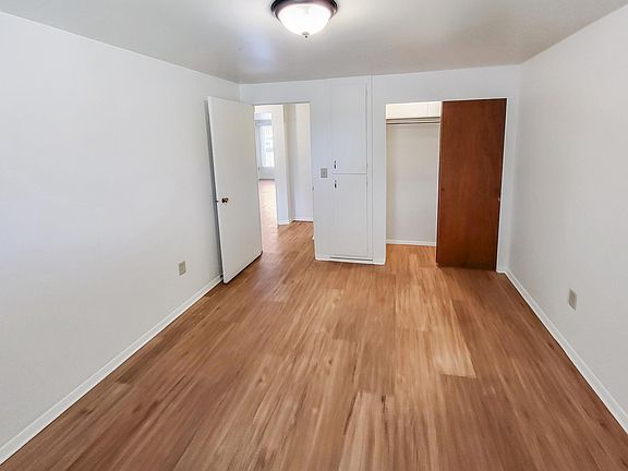 Bedroom with large closet and built in cabinetry