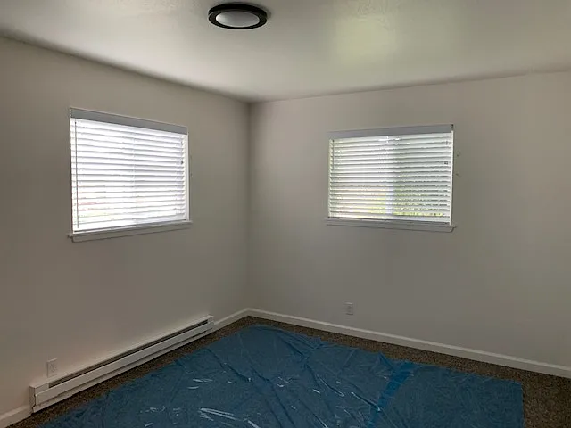 bedroom with new carpets (currently covered for your protection)