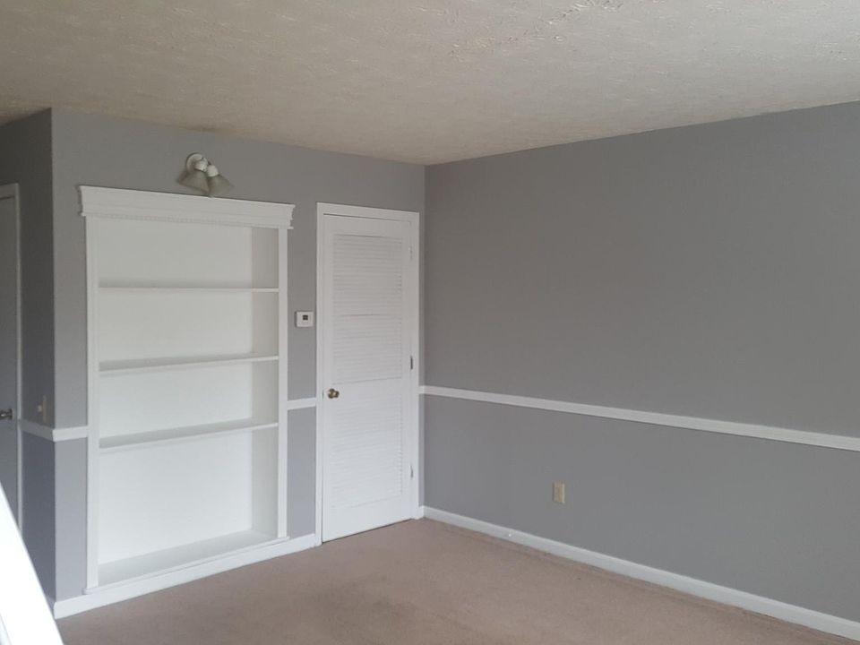 living room with built in book cases
