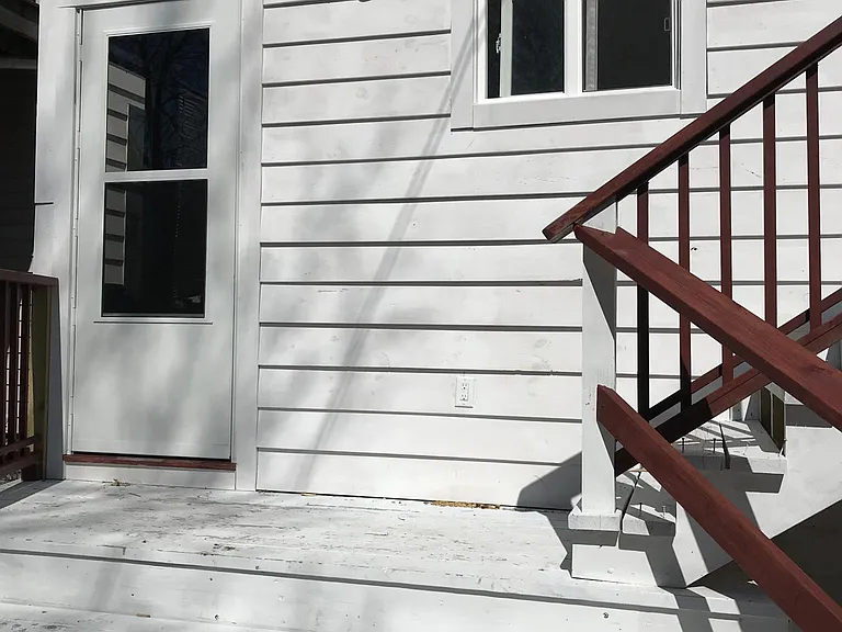 Stairs to fenced back yard