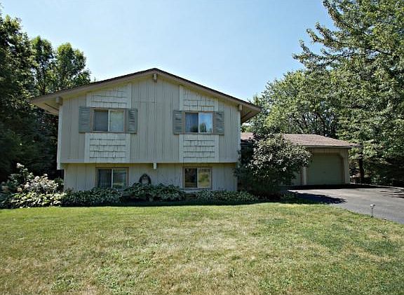 This beautiful Prior Lake GEM sits on a private treed lot with amazing backyard retreat!