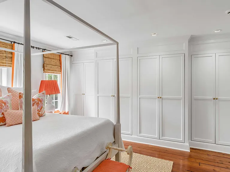 Master bedroom floor to ceiling built in wardrobe .