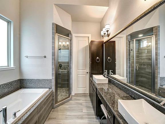 Gorgeous master bath with huge walk-in closet.