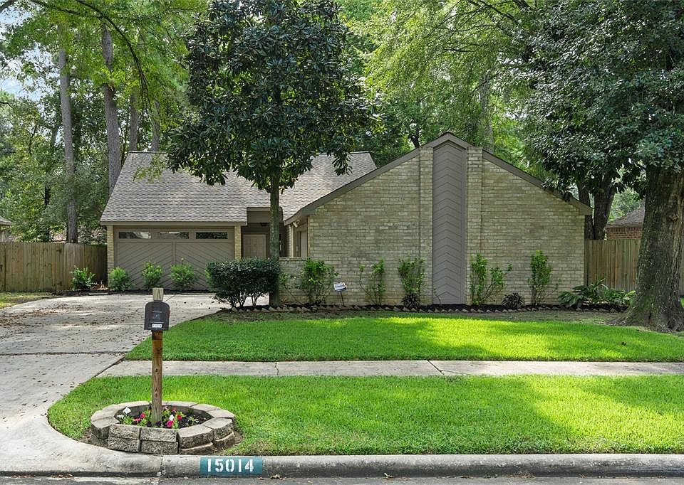 Welcome home to 15014 Forest Lodge Drive.