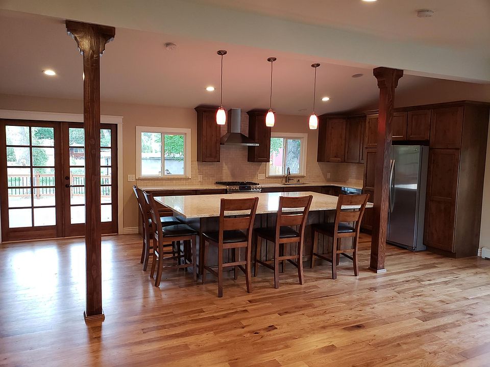 Kitchen Island and custom french doors leading to deck and fabulous view of North Table Mountain