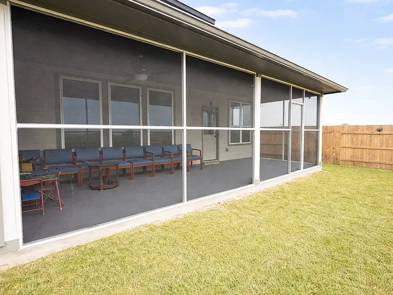 Covered & Screened back patio with painted floor