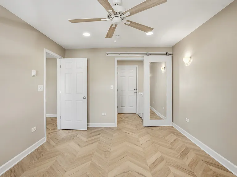Main bedroom with walk in closet and laundry.