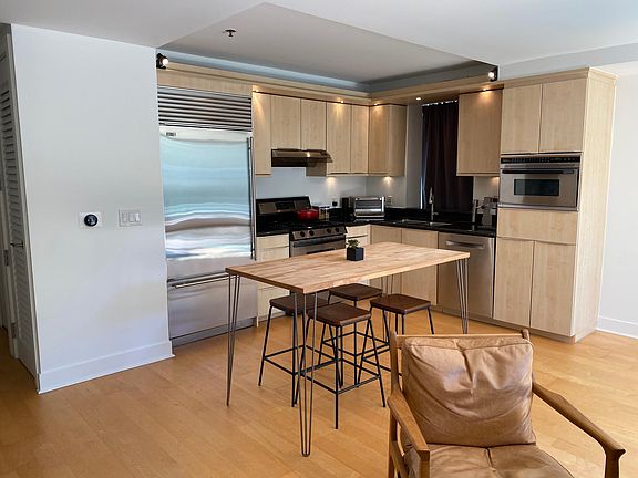 Designer kitchen with stainless appliances and new Bosch dishwasher