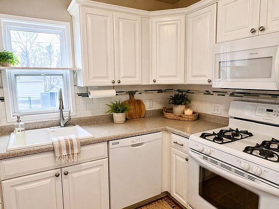 Updated kitchen with dishwasher and gas stove.