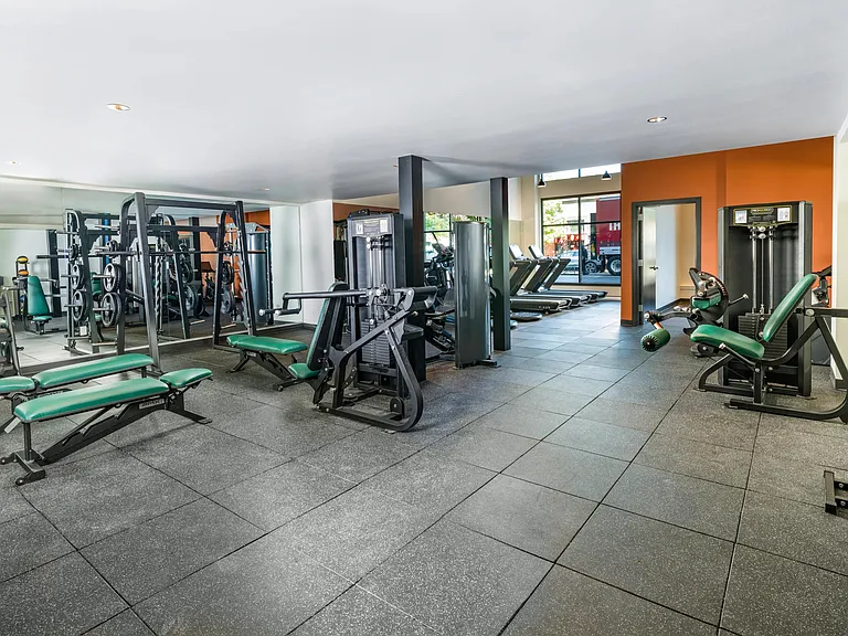 Achieve your fitness goals at Modera Woodstock's club-quality fitness center, complete with state-of-the-art cardio equipment and dedicated spin bikes for an invigorating workout experience.