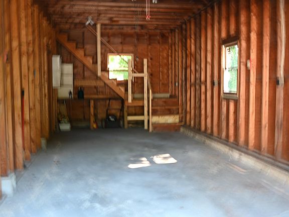 Inside of the garage (stairs lead to storage area)