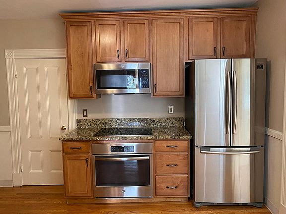 granite kitchen outfitted with stainless steel appliances and french door refrigerator
