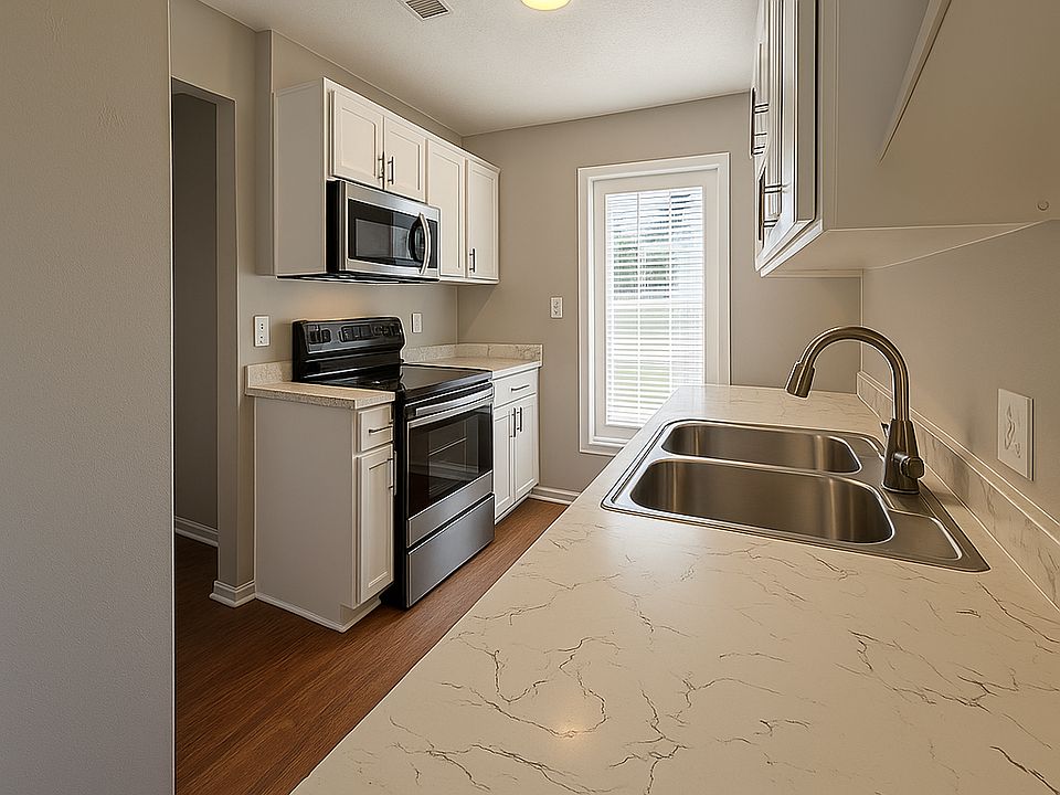 Modern kitchen with ample cabinet space and sleek finishes_functional and stylish for home cooking.