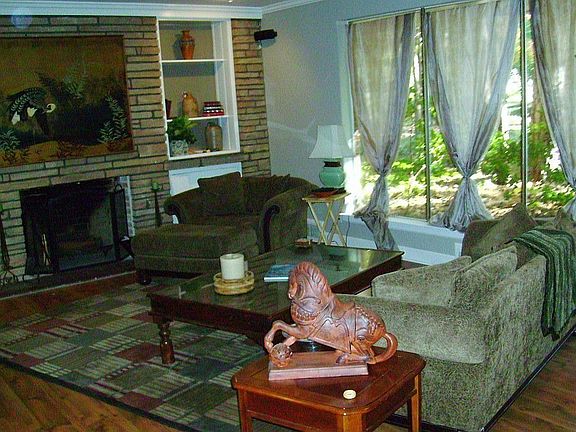 The Sunken Living Room Really is Large and has more large windows, hardwood floors, and a fantastic 