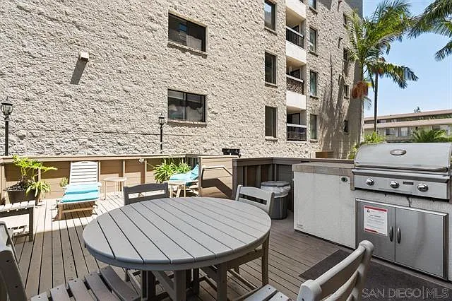 COMFORTABLE BBQ AREA AND POOL/SPA AREA BETWEEN THE TWO TOWERS