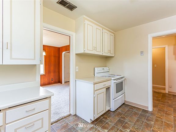 Dining room entry is to the left, the back door is through the doorway on the right.