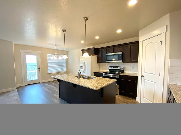 Separate Dining Area next to Back Patio Access. Spacious Pantry