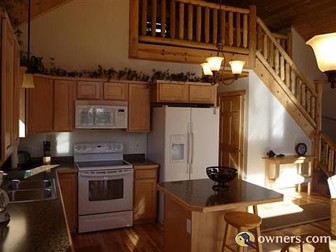 Kitchen and railing to loft
